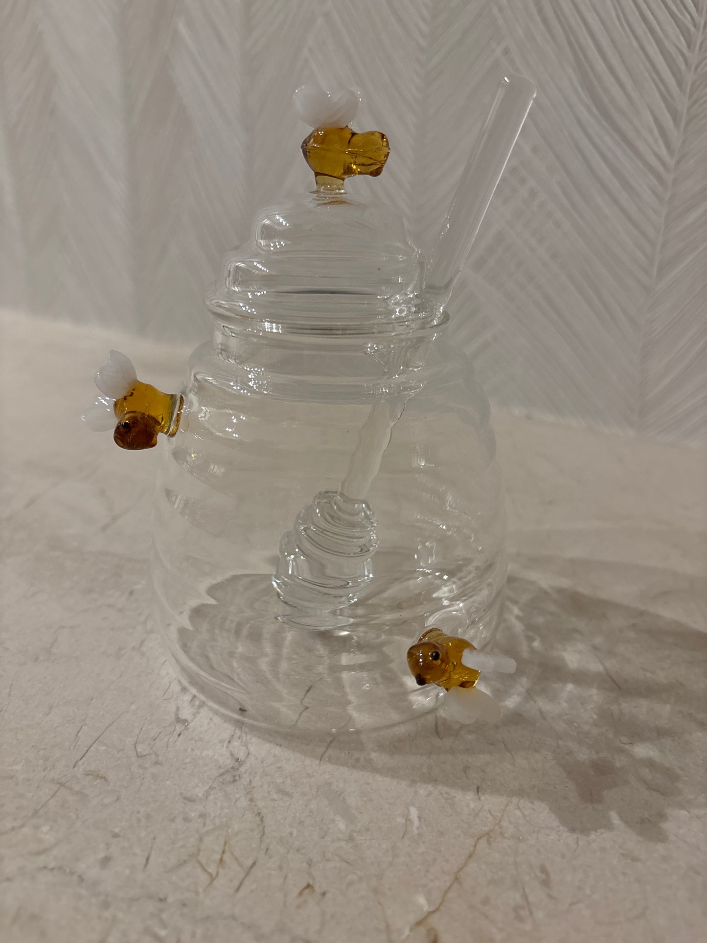 Honey jar with bees everywhere